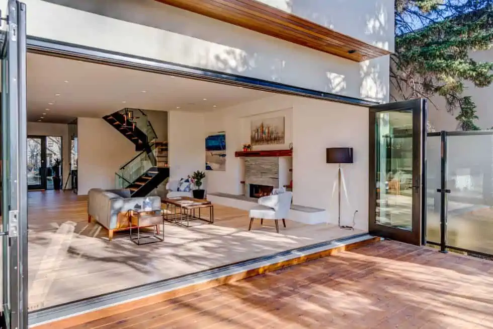 A living room with sliding doors that opens to a large patio.