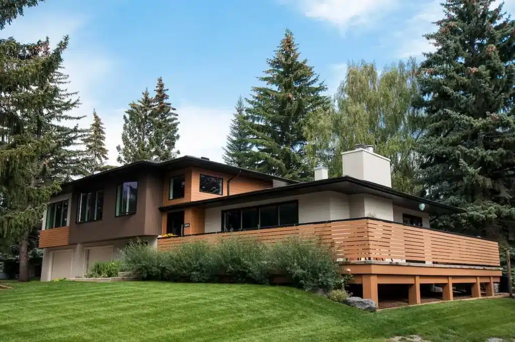 A renovated home in Calgary with a privacy deck and large backyard.