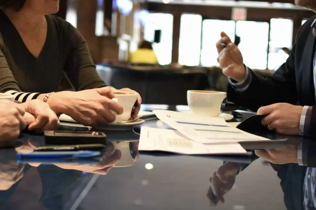 A custom home designer meets with a client to discuss building the right team for their project.