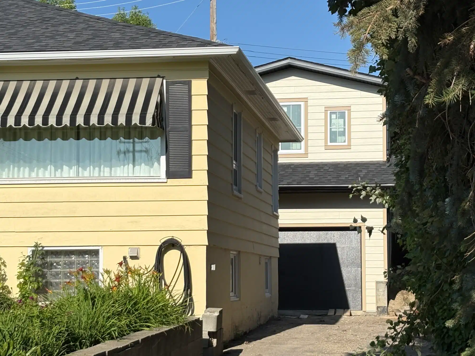 Two interior designers in Calgary look at home design drawings.