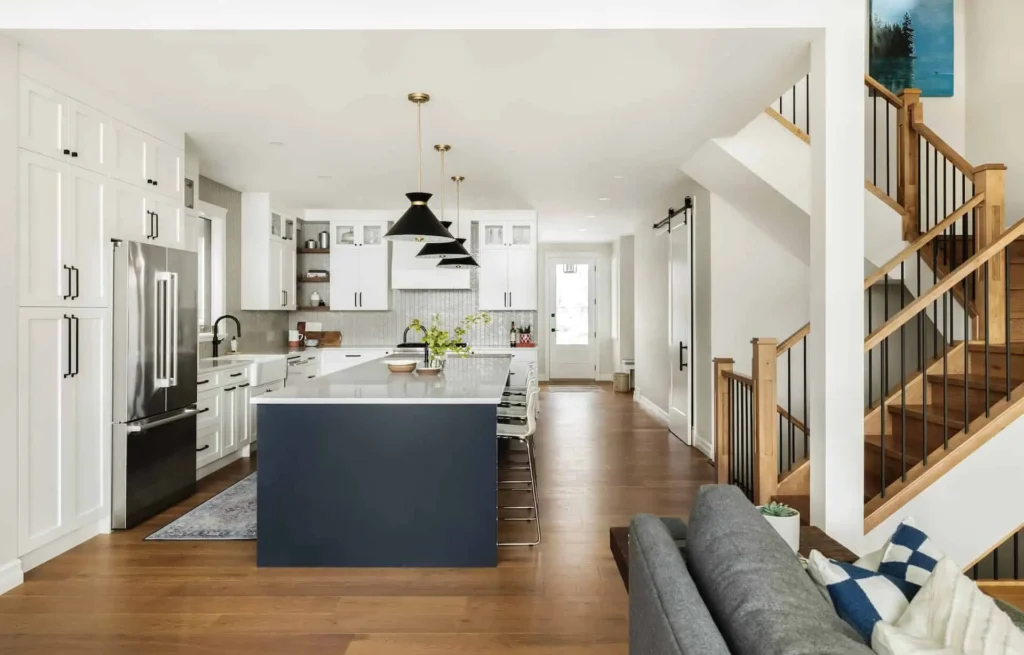 The flow of a kitchen into a living room in a new home in Calgary.
